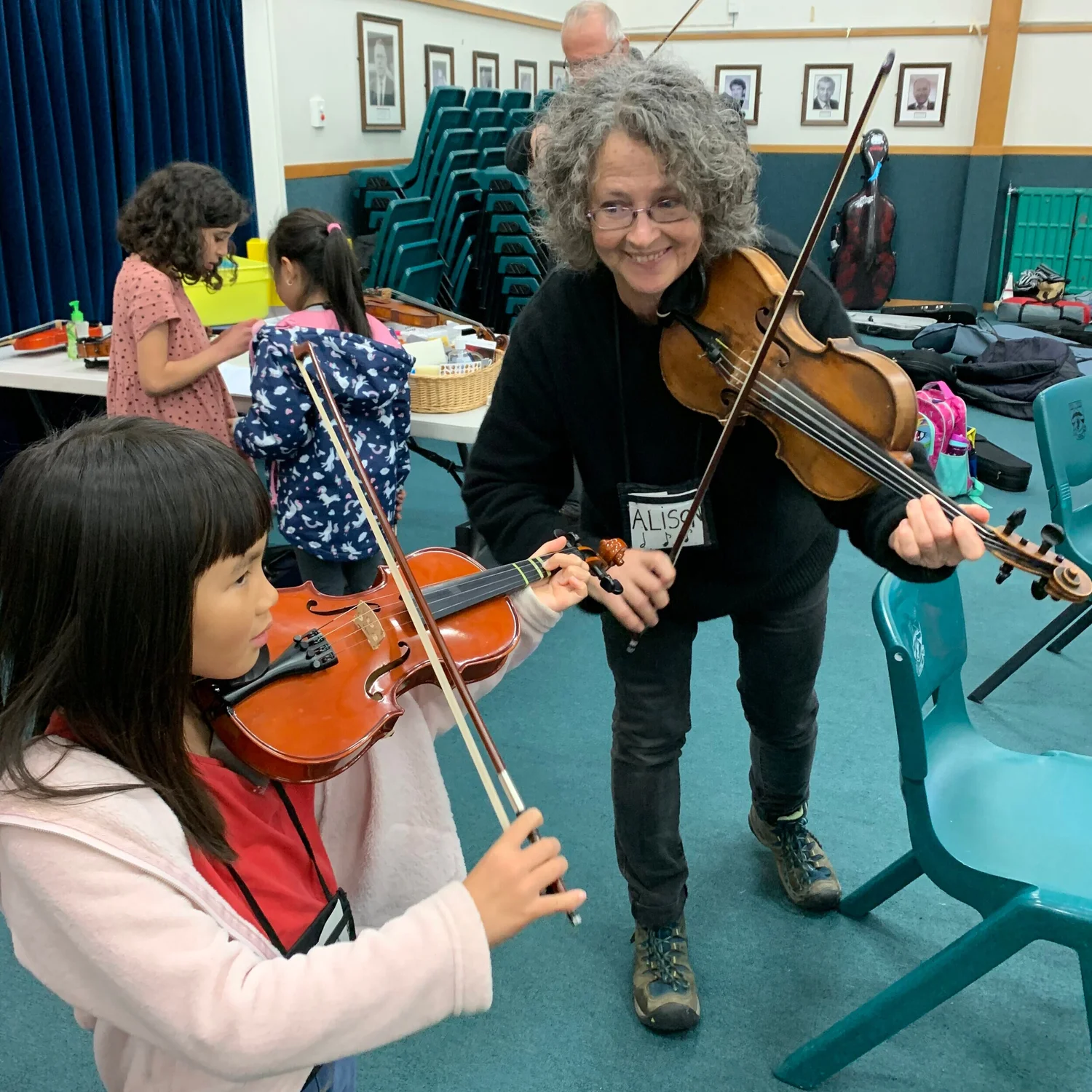 Founder Alison Eldredge helping a young student